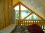 Second bedroom in loft is also open to main living area and beautiful view of lake